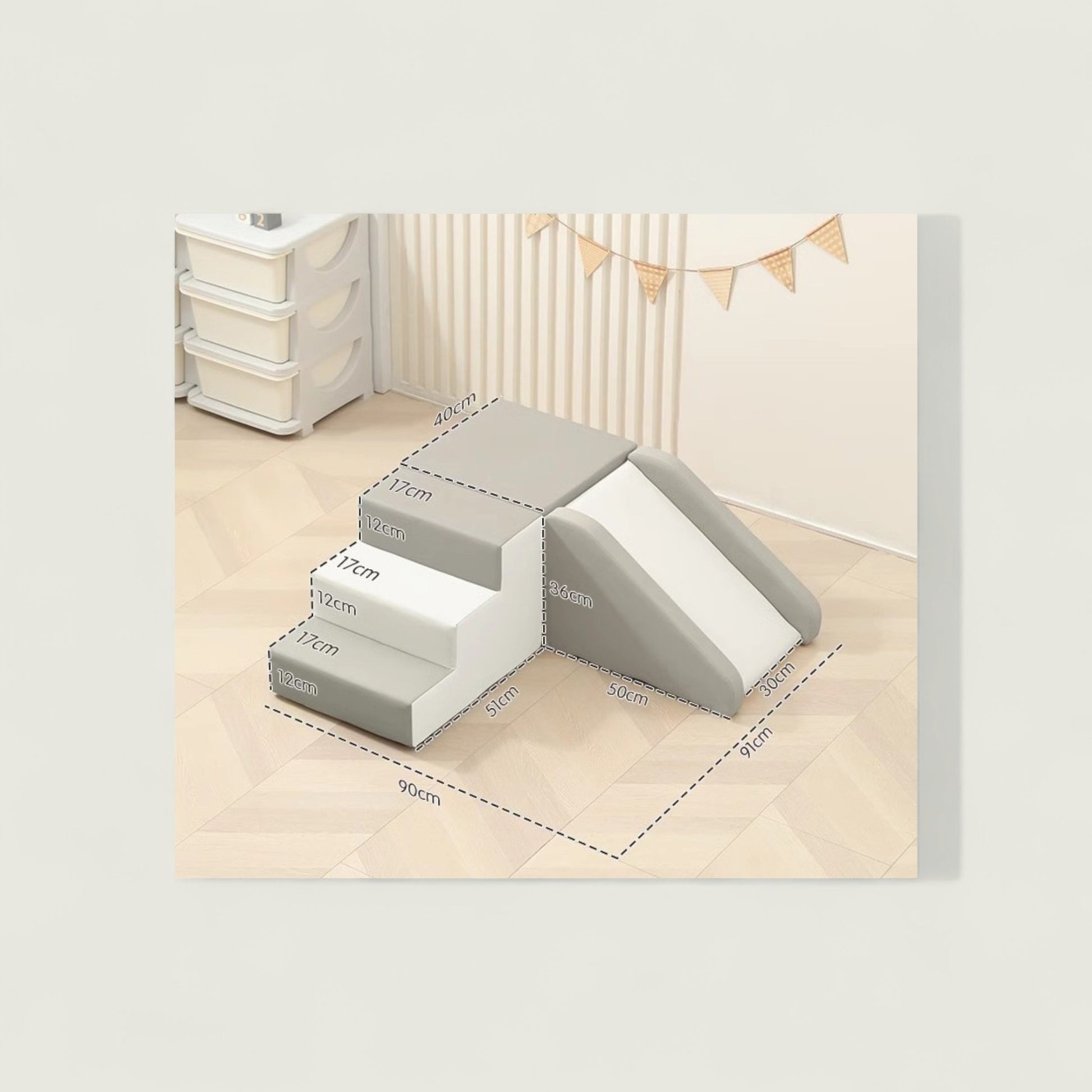 Set of gray foam steps with measurements on a light wood floor.