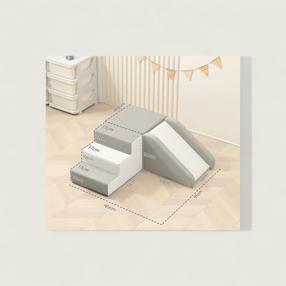 Set of gray foam steps with measurements on a light wood floor.