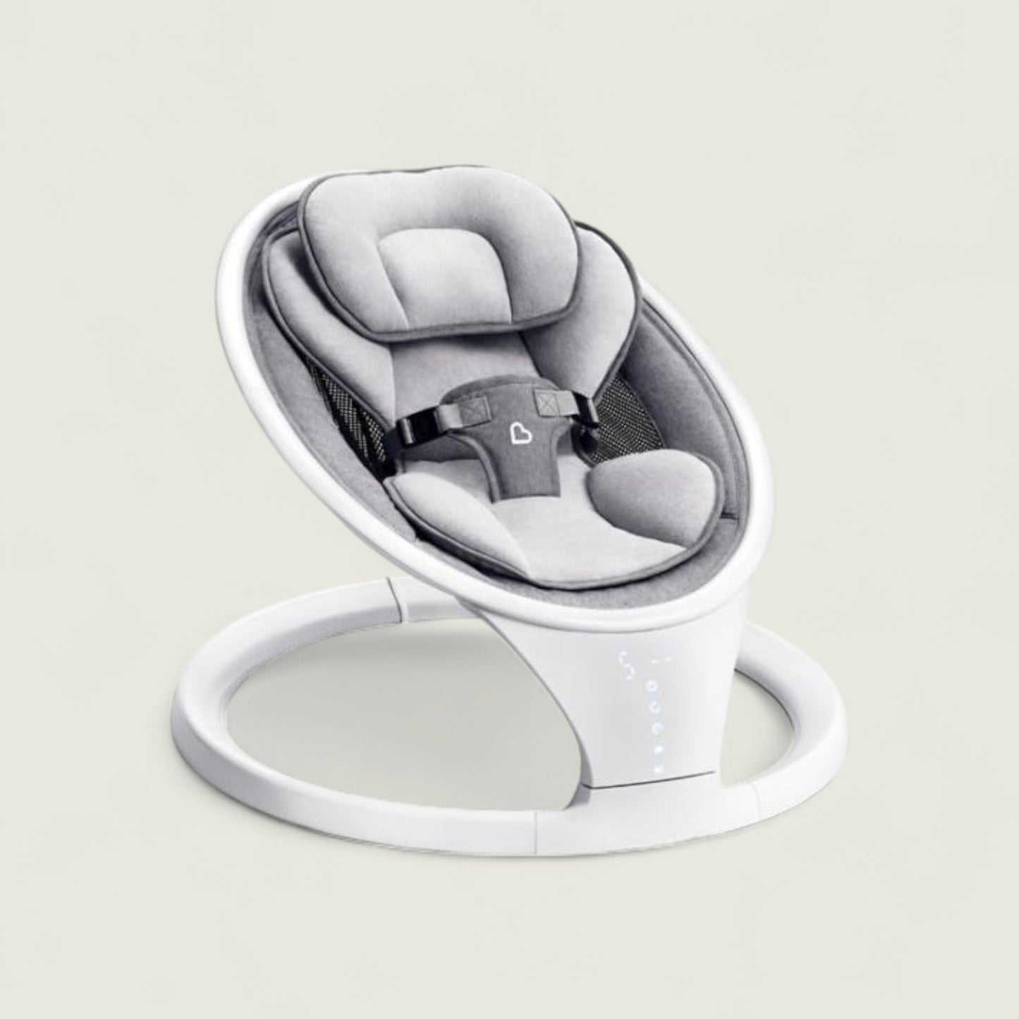 Baby swing with gray seat and white base on a light gray background
