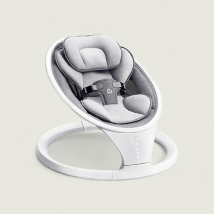 Baby swing with gray seat and white base on a light gray background