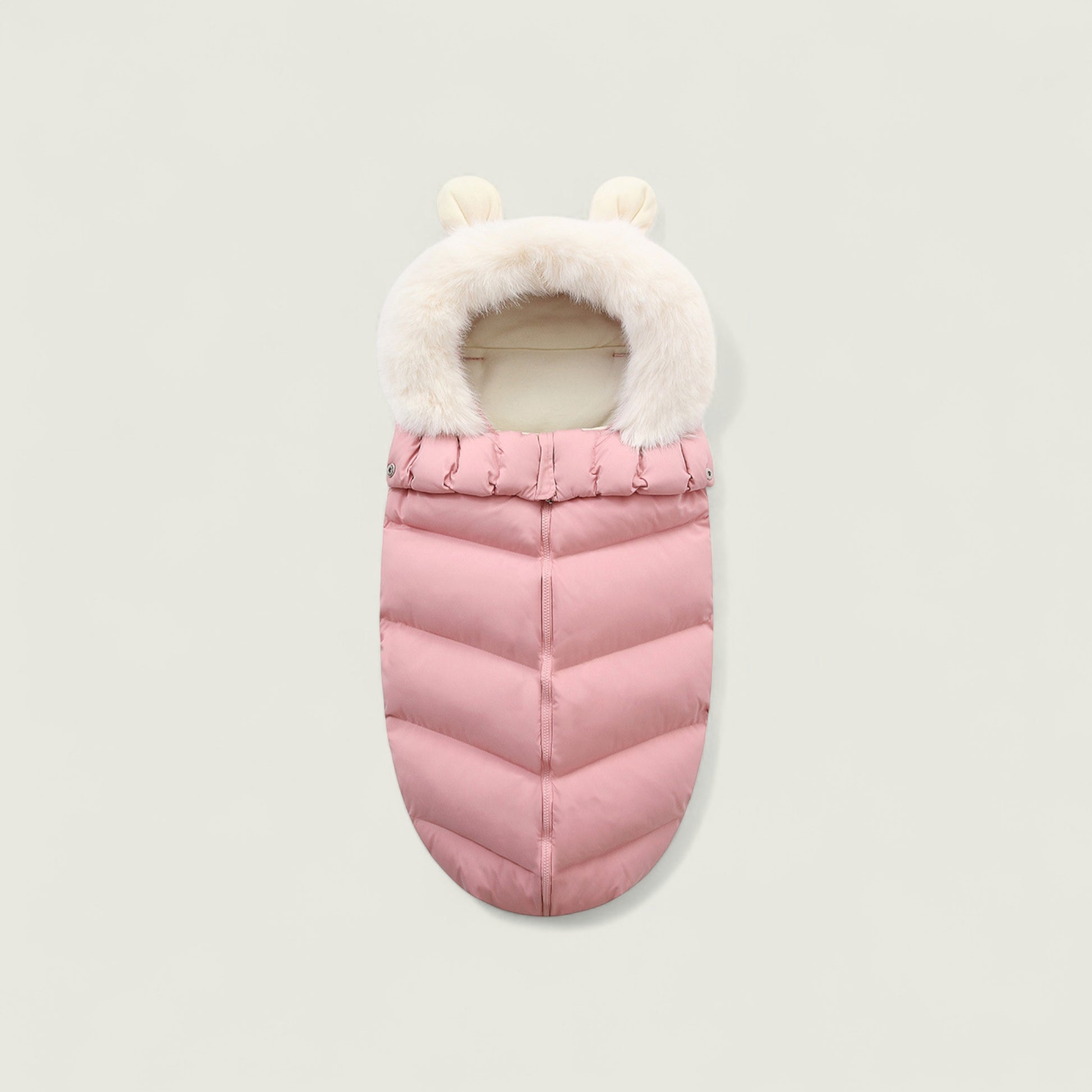 Pink baby sleeping bag with white fur trim on a light gray background