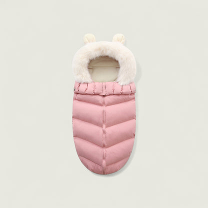 Pink baby sleeping bag with white fur trim on a light gray background
