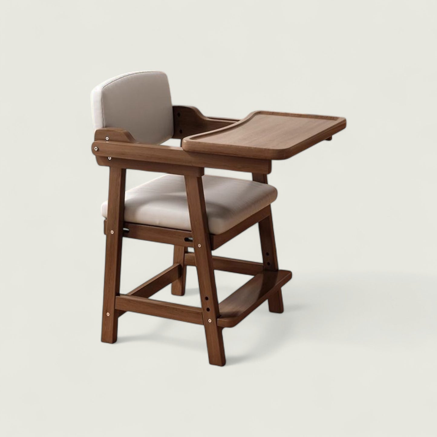 Wooden high chair with beige cushion on a white background