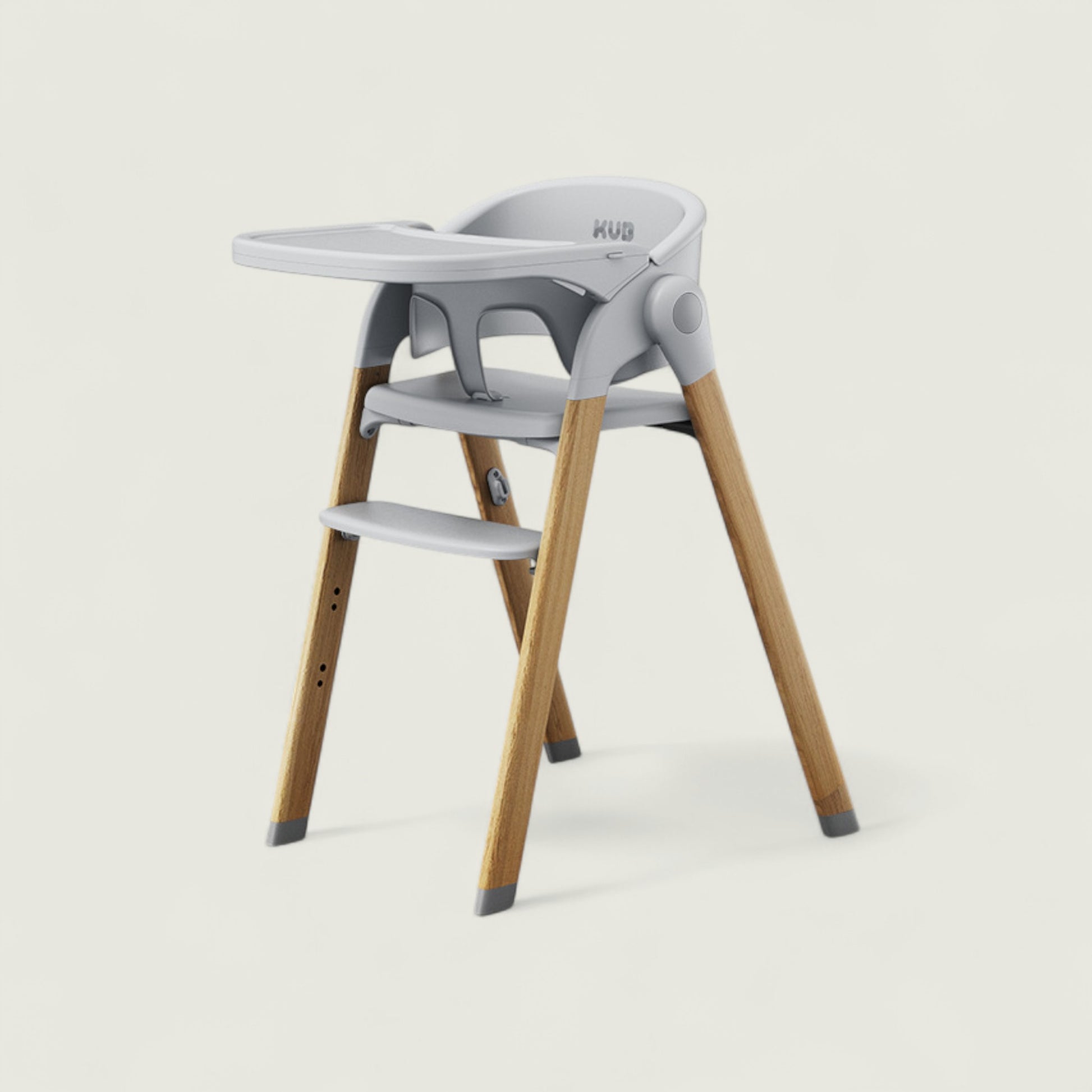 Gray high chair with wooden legs on a light background