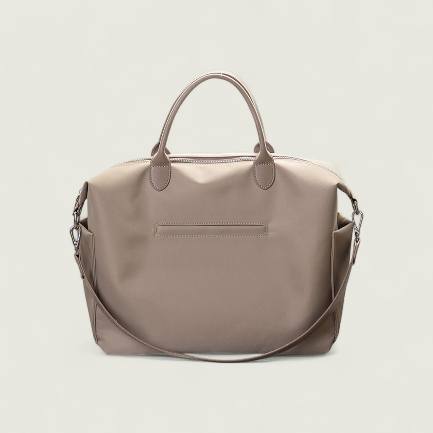 Beige handbag with a shoulder strap on a light beige background