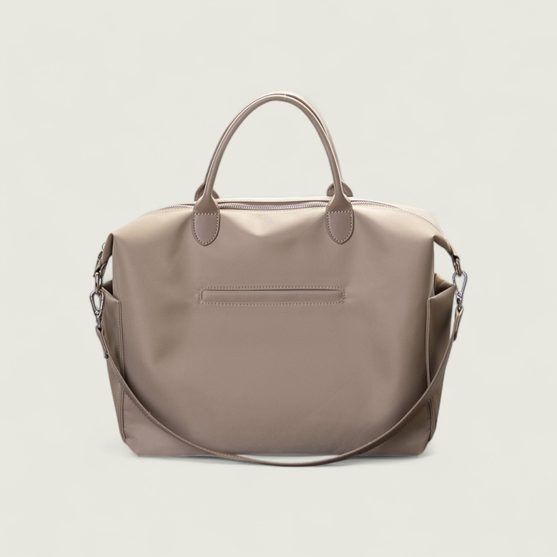 Beige handbag with a shoulder strap on a light beige background