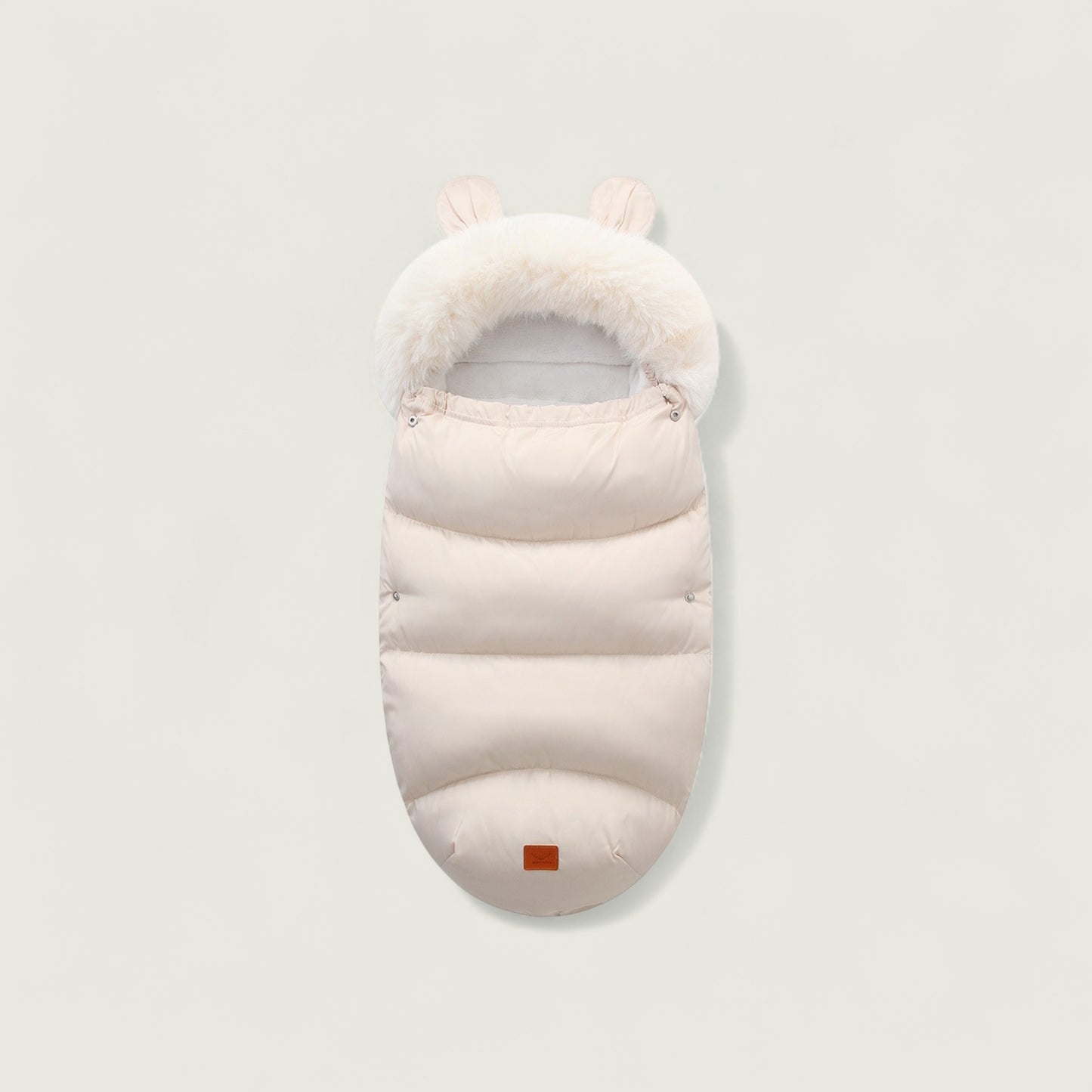 White baby sleeping bag with fur trim on a light gray background