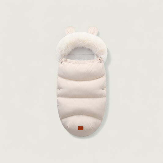 White baby sleeping bag with fur trim on a light gray background