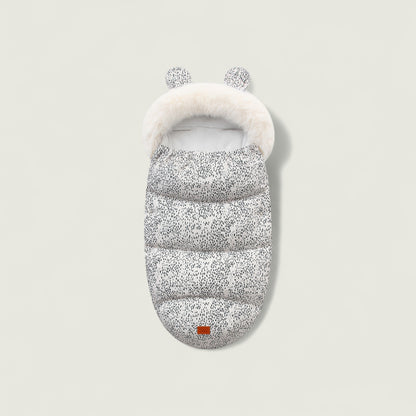 Gray puffer bag with white fur trim on a light gray background