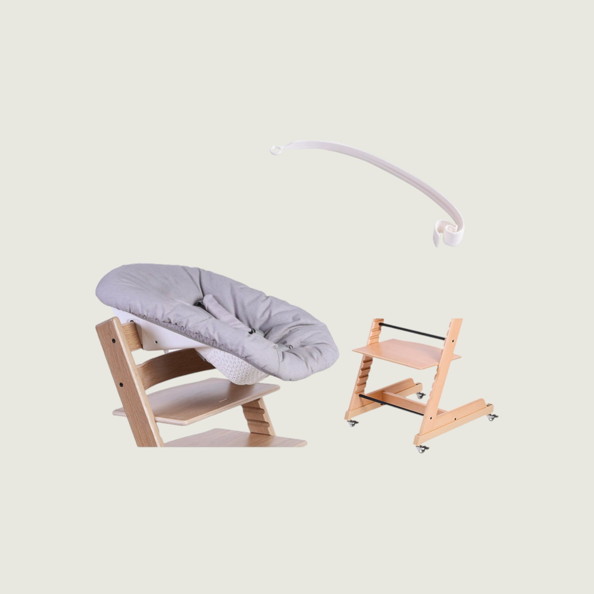 Wooden baby chair with gray cushion and pink stand on a light beige background