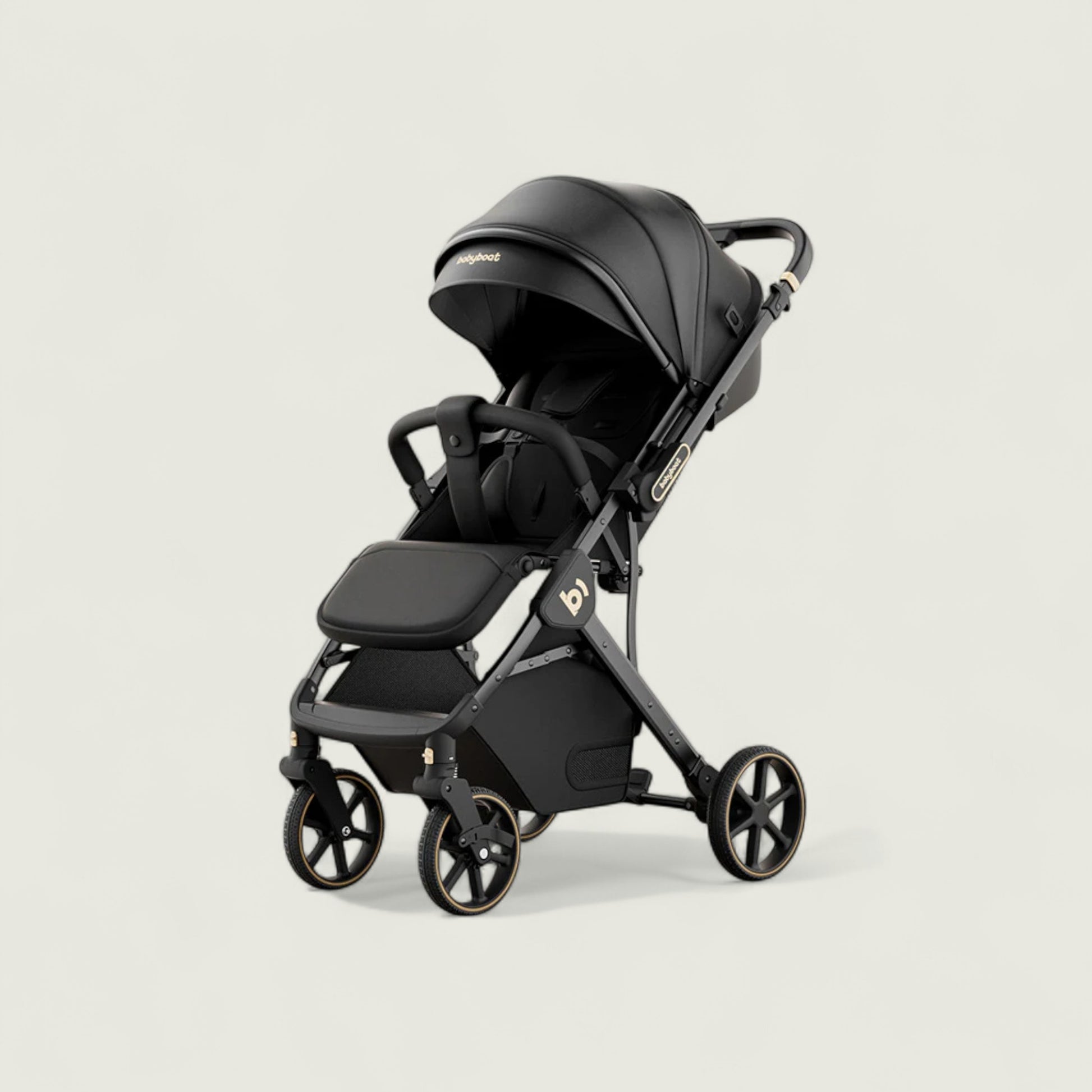 Black stroller on a light beige background