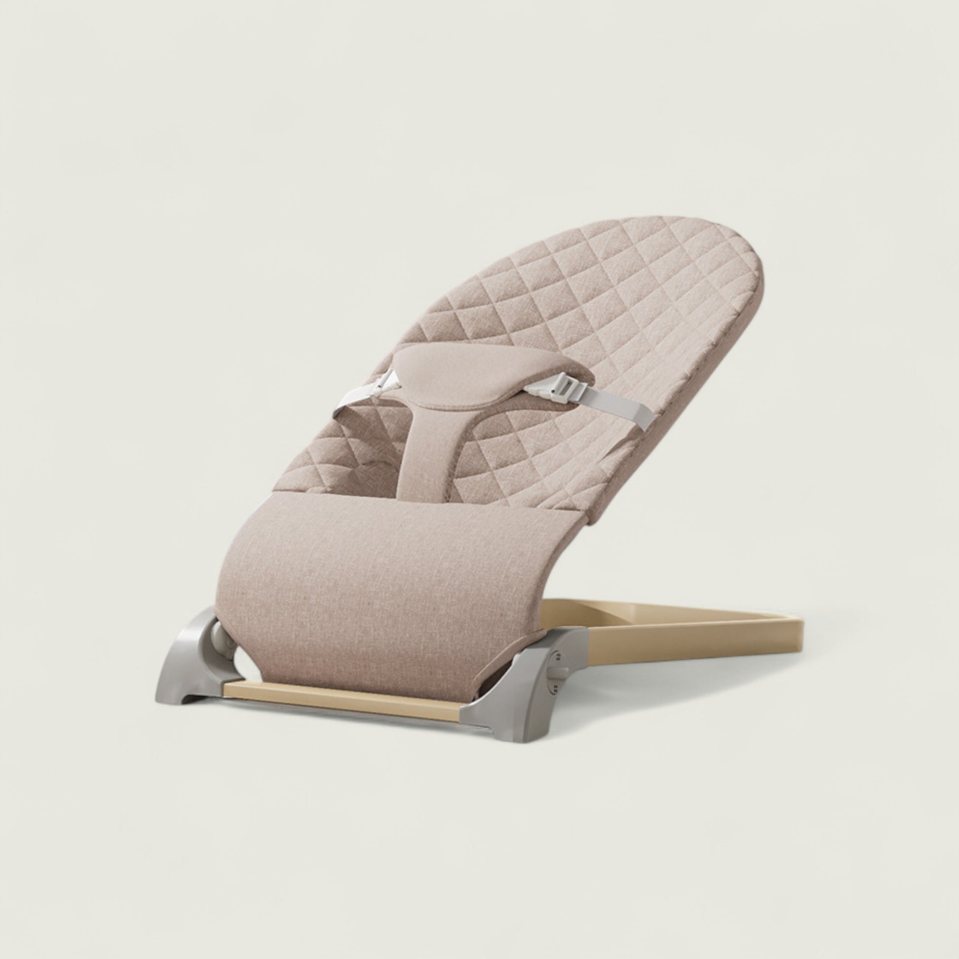 Beige baby bouncer on a light gray background