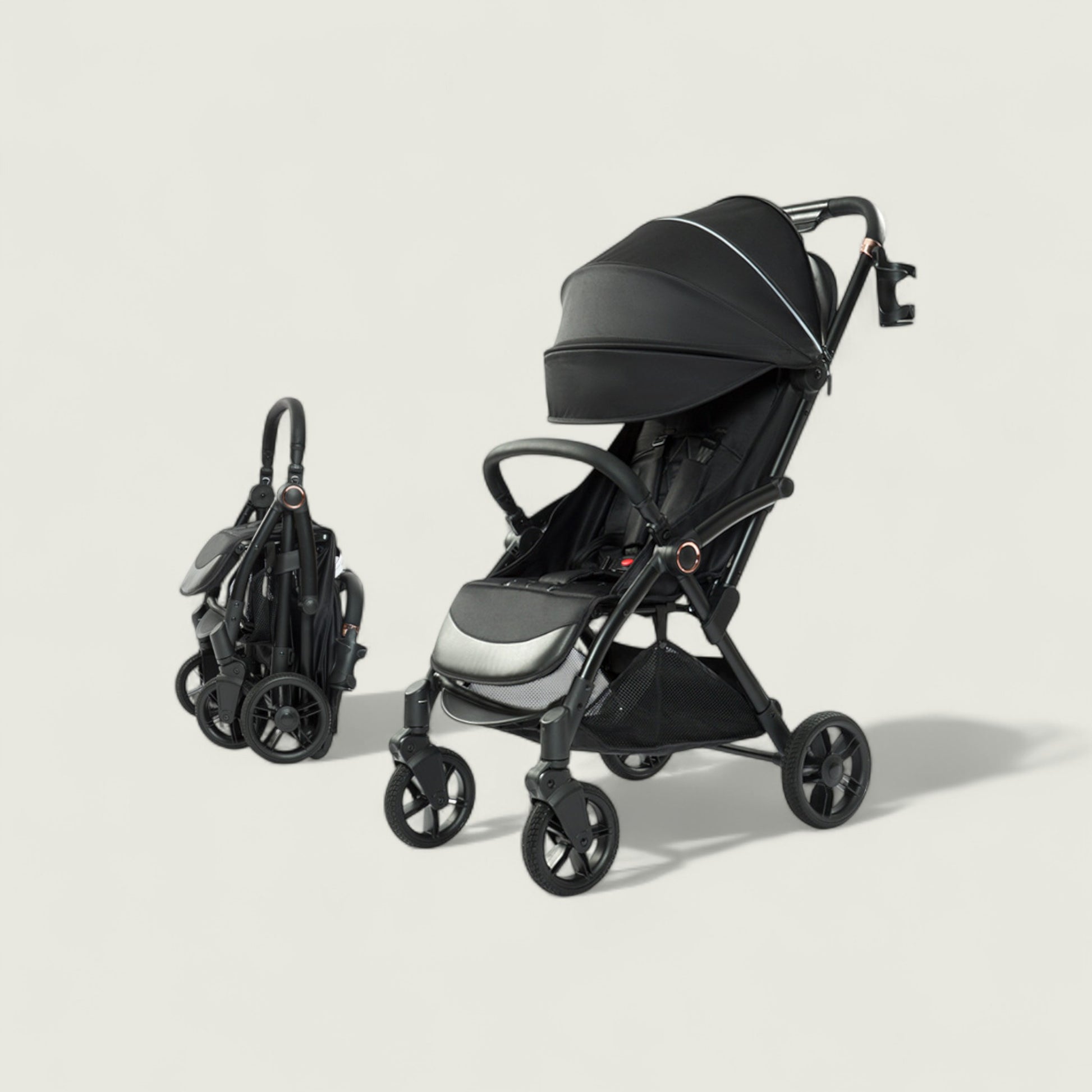 Black and gray stroller on a light beige background