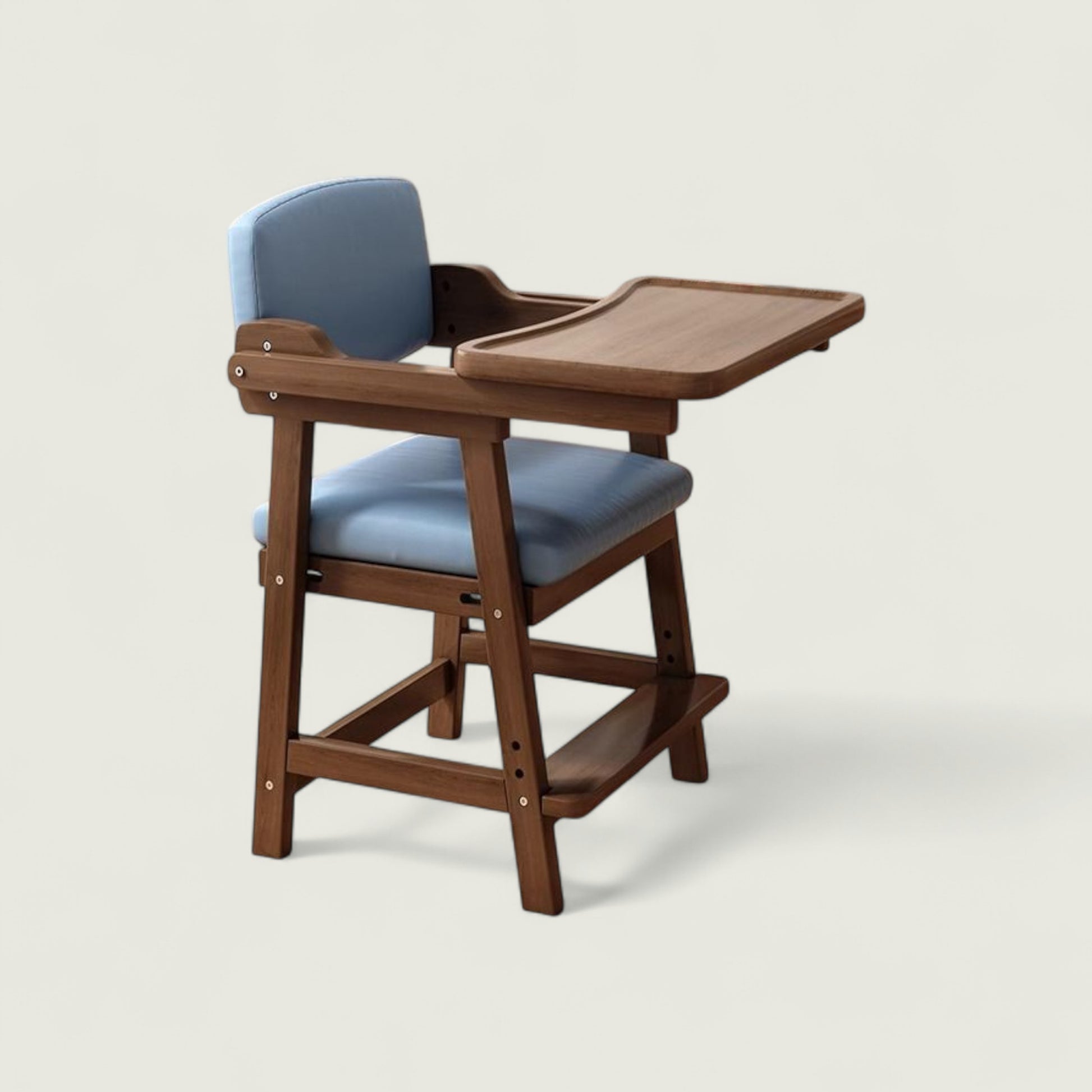 Wooden high chair with blue cushion on a light gray background