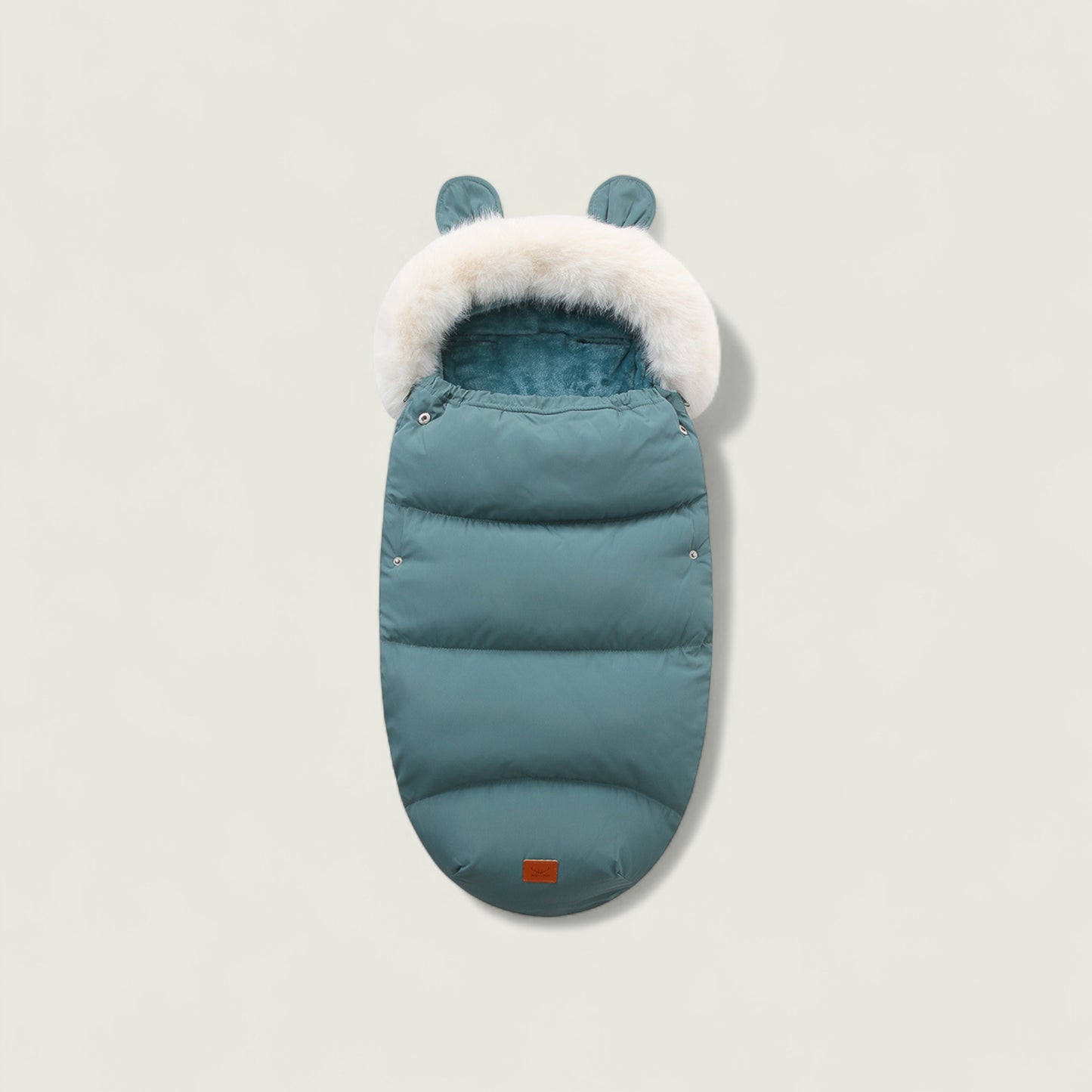 Teal baby sleeping bag with white fur trim on a light gray background