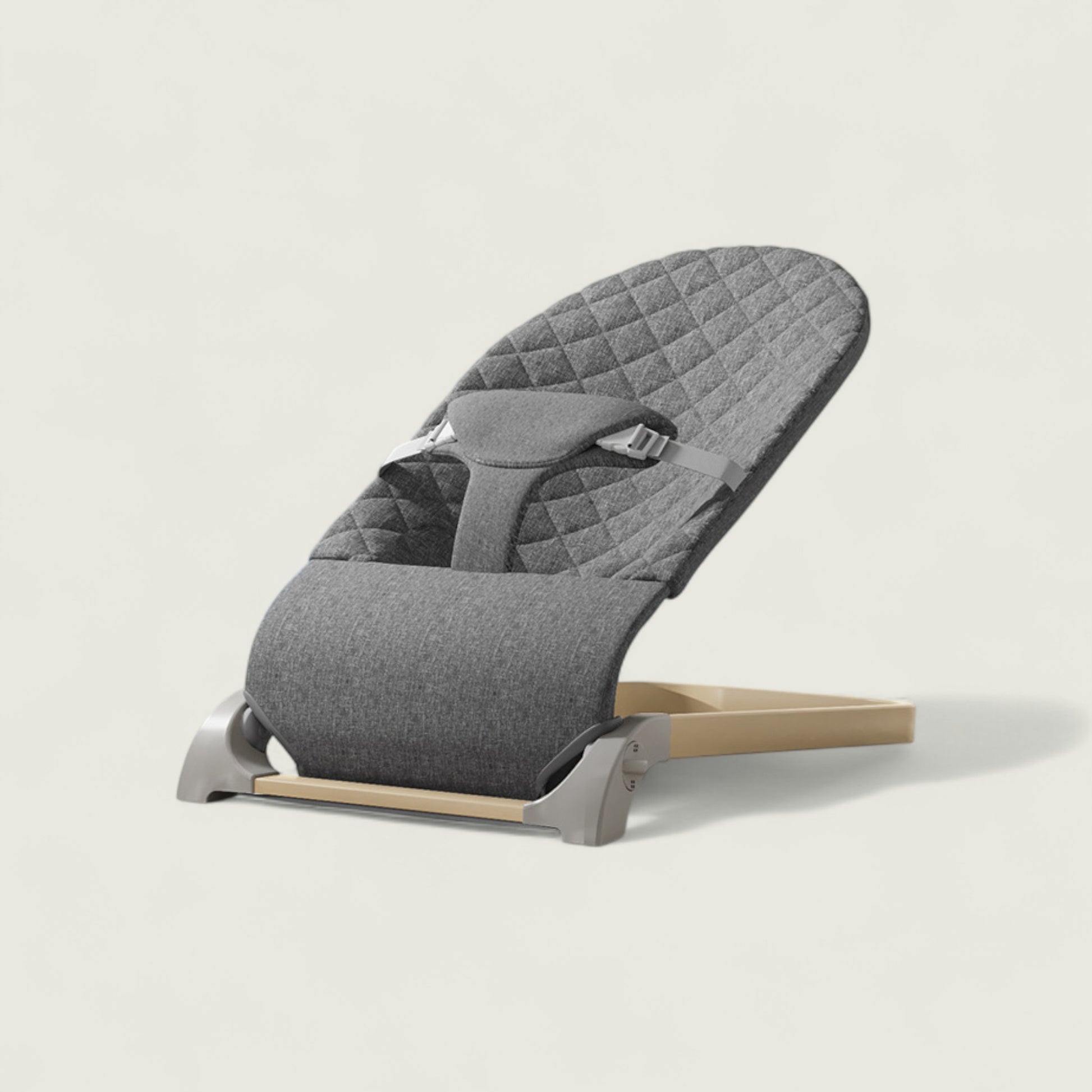 Gray baby bouncer on a light gray background