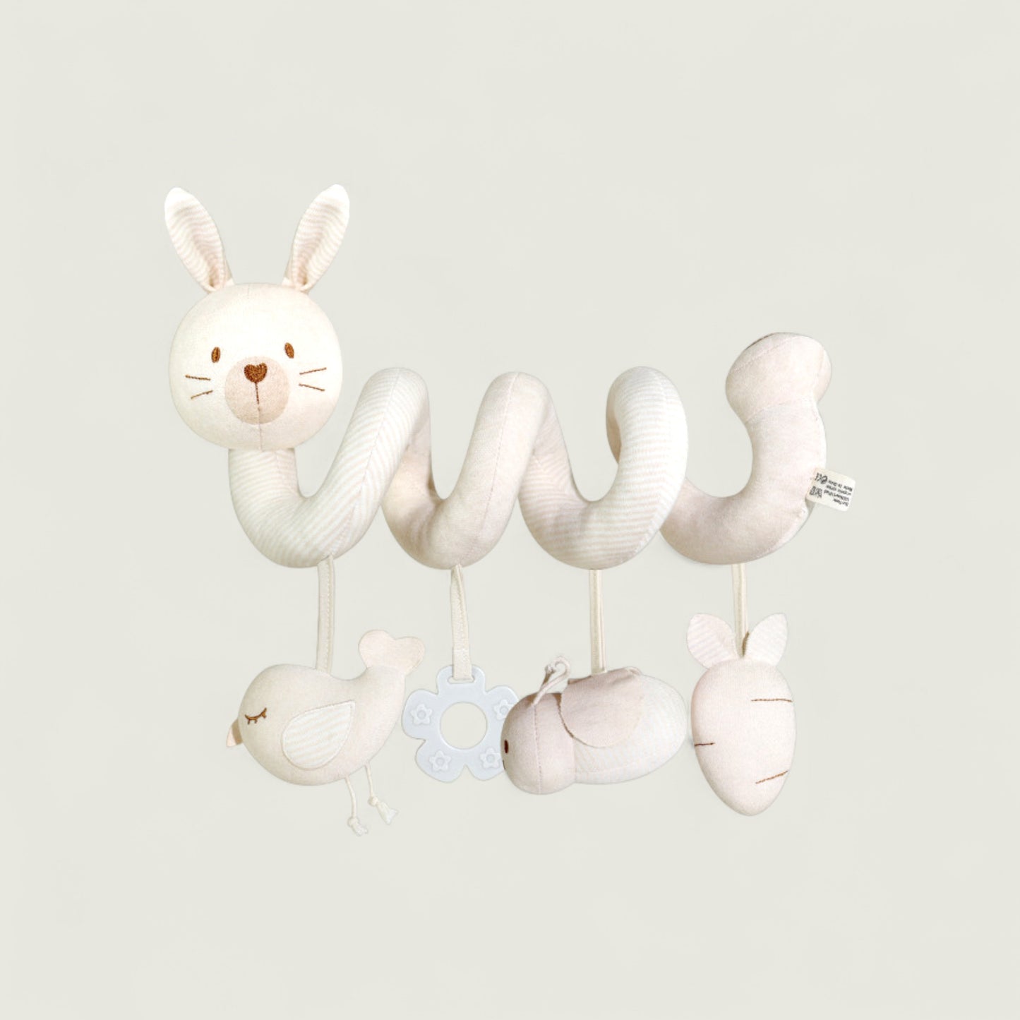 White baby crib mobile with bunny design on a light gray background