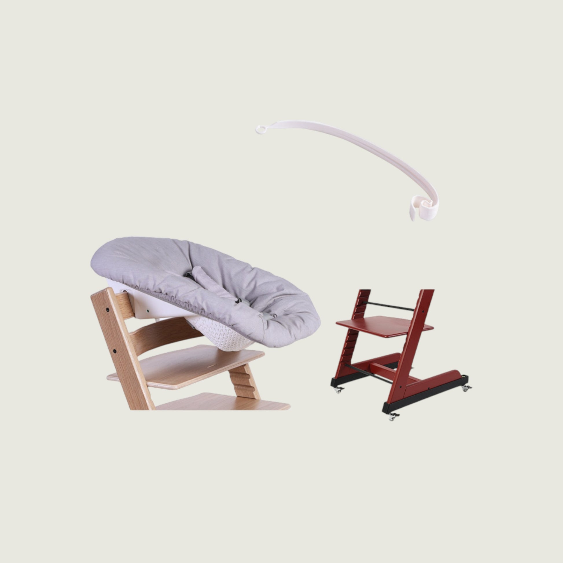 Wooden baby swing with gray cushion and red high chair on a beige background