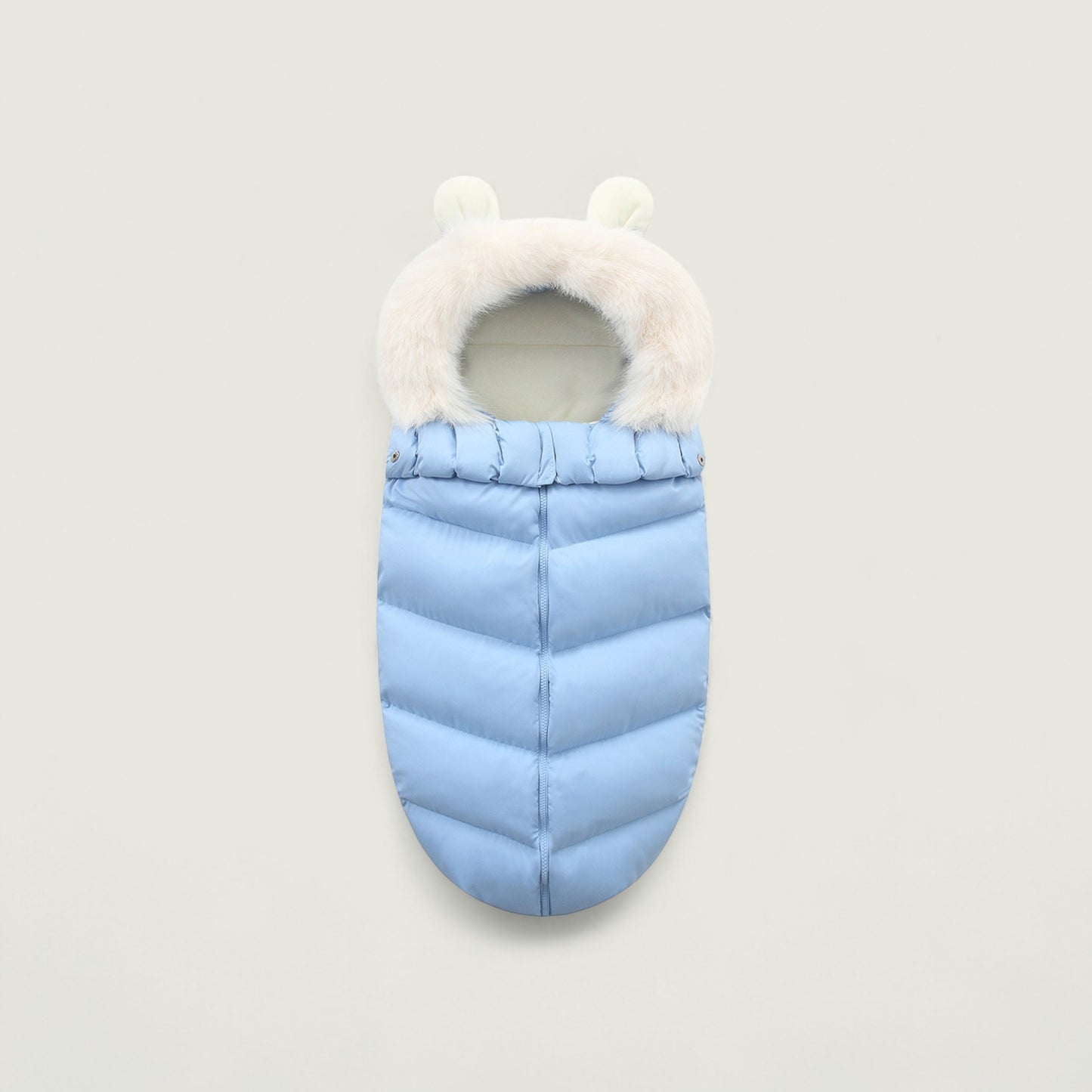 Light blue baby sleeping bag with white fur trim on a light gray background