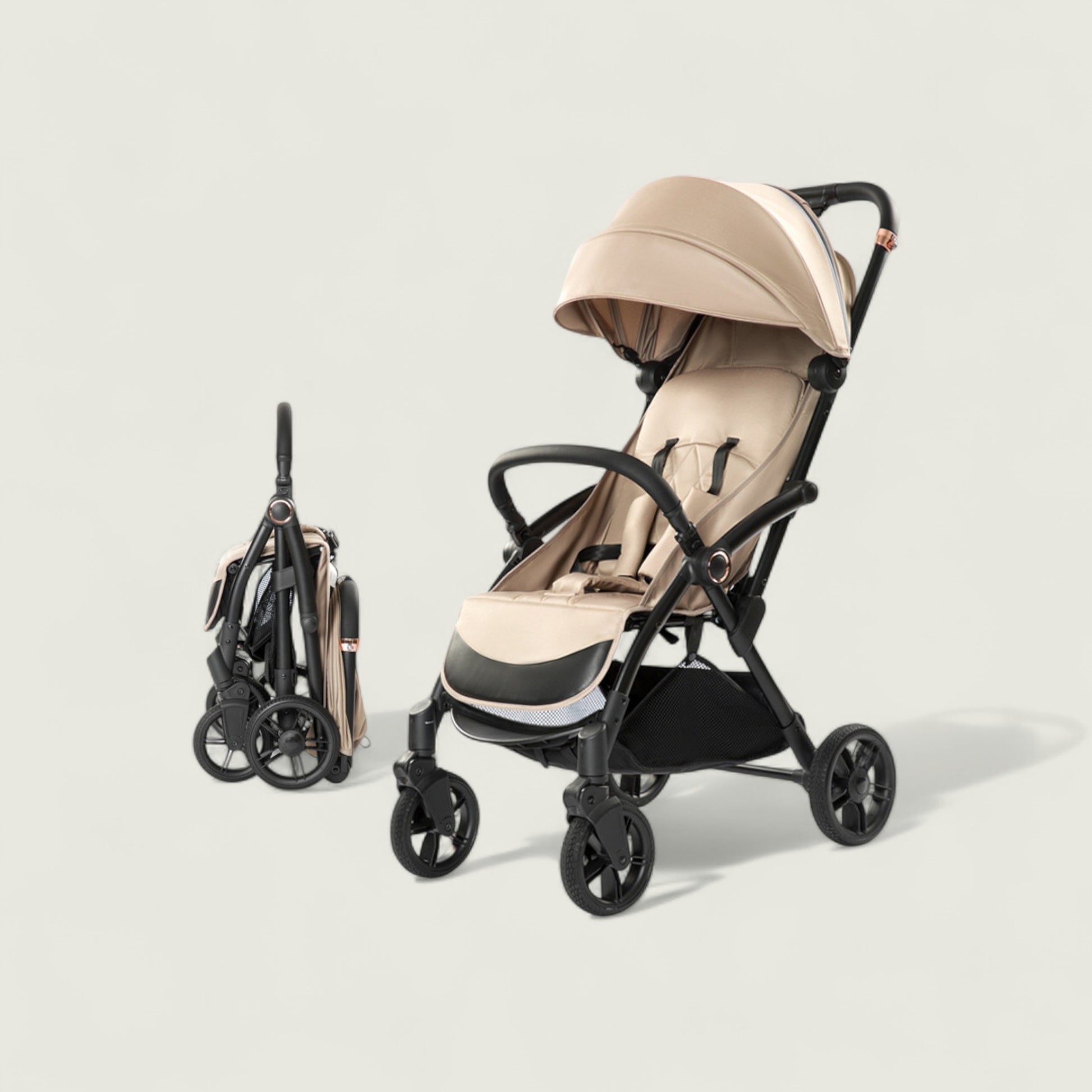 Beige and black stroller on a light gray background