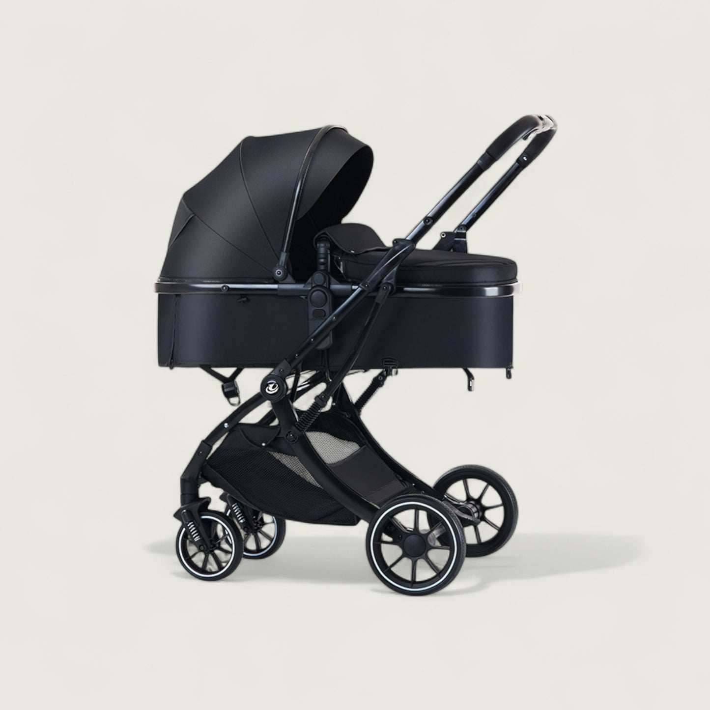 Black baby stroller on a light beige background