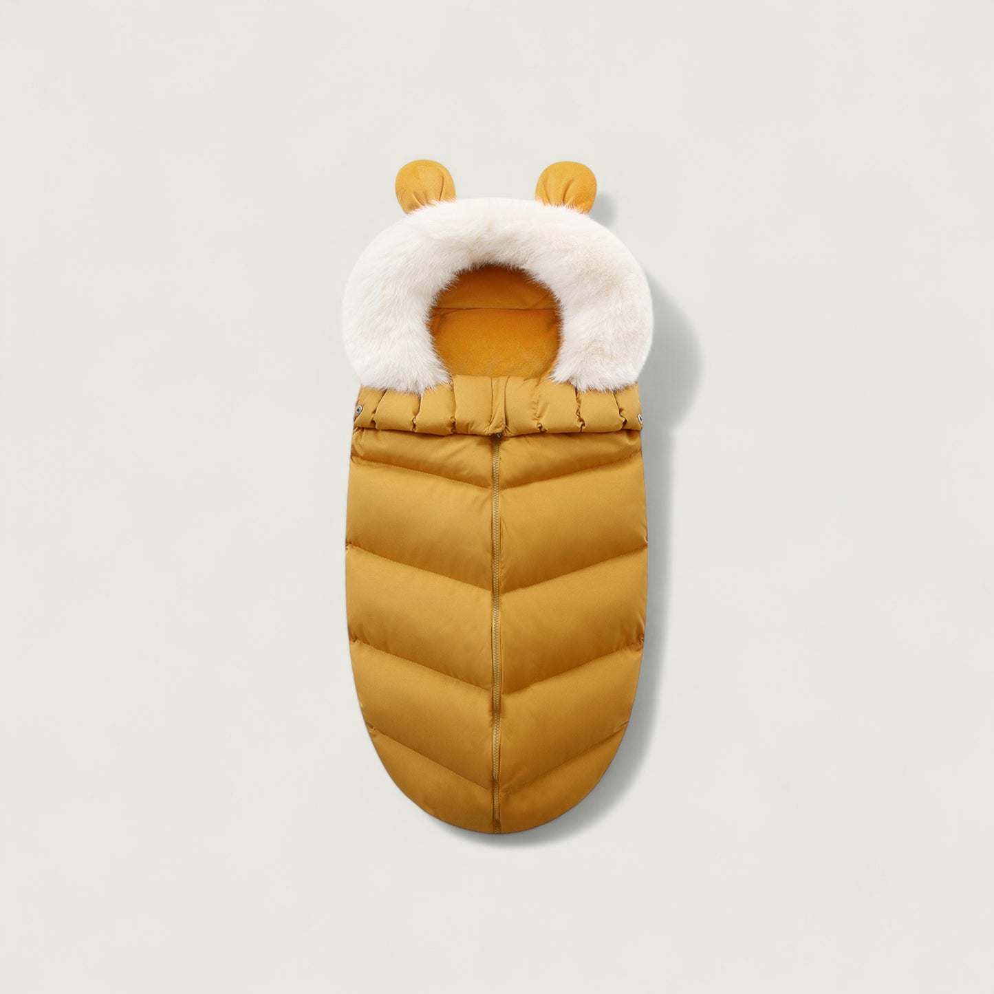Yellow baby sleeping bag with white fur trim on a light gray background