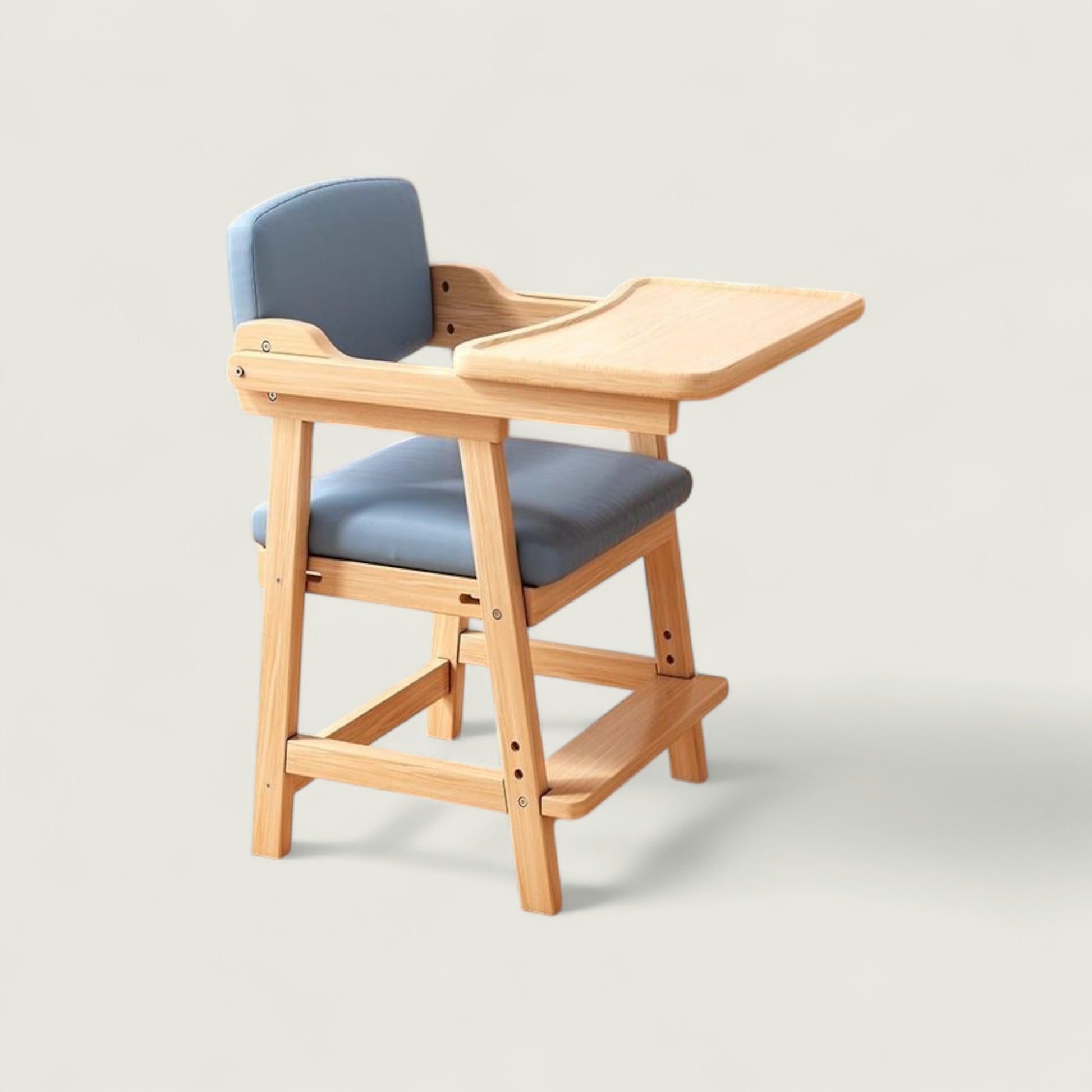 Wooden high chair with gray cushion on a light gray background
